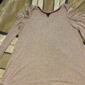 Brownish purplish long sleeve with holes for the shoulder
